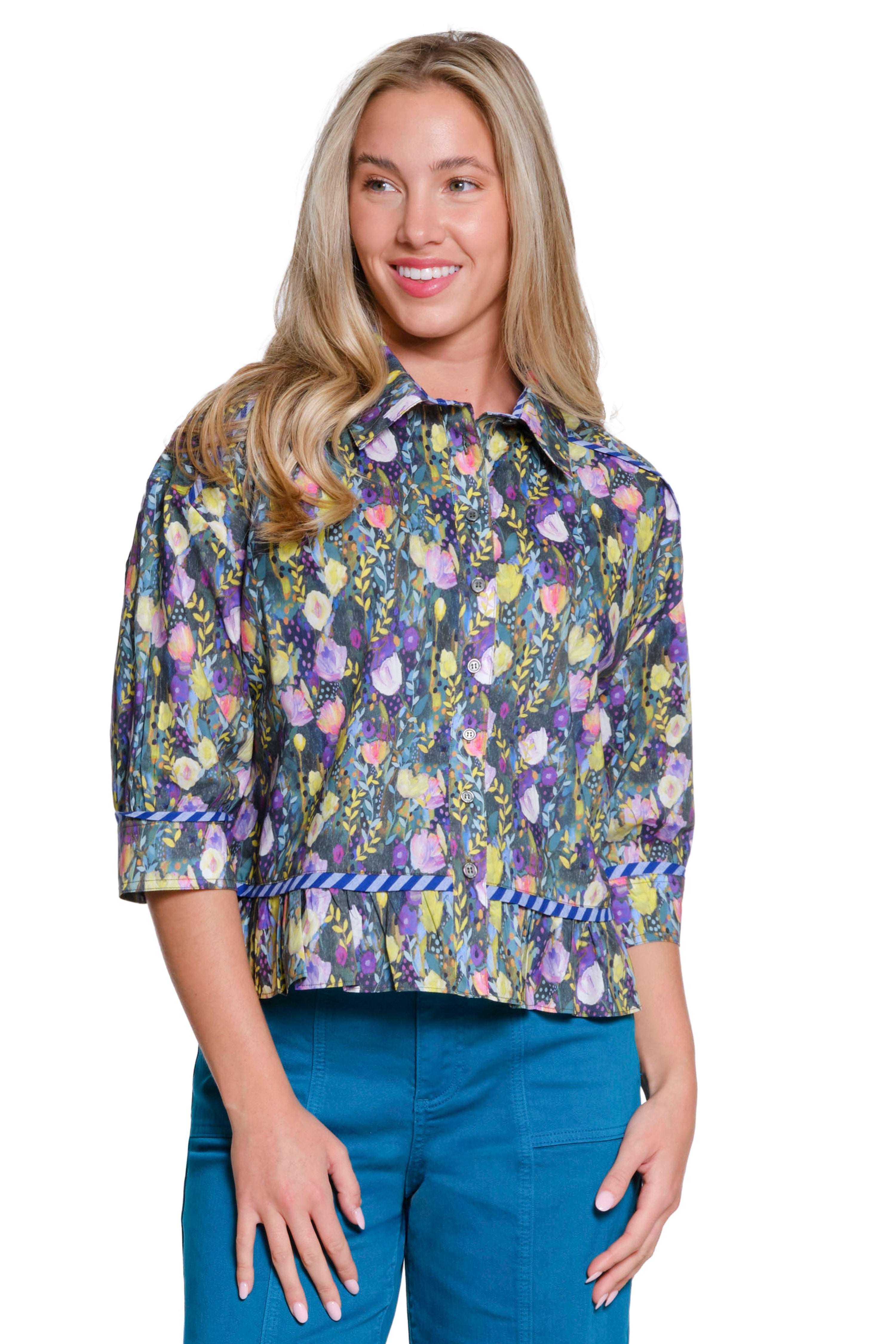 Woman wearing a floral blouse with a white background